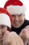 Smiling Couple Pointing Forward Stock Photo