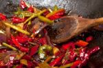 Fried Chili Pepper And Vegetable On A Wok Pan Stock Photo