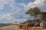 Beach And Cliffs In Quarteira Stock Photo