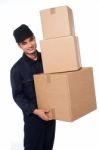 Young Courier Boy Moving Boxes Stock Photo