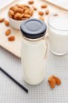 Almond Milk In Bottle With Straw And Almonds Stock Photo