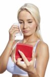 Young Woman Clean Face With Wet Wipes And Holding Mirror Stock Photo