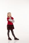 Little Girl In Red Dress Posing Standing In Studio Stock Photo