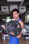 Muscular Bodybuilder Men Doing Exercises With Dumbbells In Gym Stock Photo