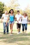 Family Having Fun In Summer Park Stock Photo