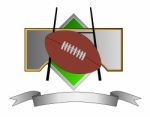 Football And Goal Post On Metal Crest Stock Photo