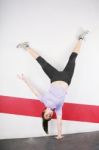 Flexible Girl Standing On One Hand Stock Photo