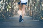 Woman Walking On Wooden Bridge. Vintage Tone Stock Photo