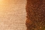 Coffee Beans On Sackcloth In Sunligh Stock Photo