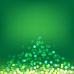 Shamrock Bokeh On Green Background For St Patrick's Day Stock Photo