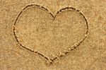 Heart Drawn In The Sand On A Sunny Day Stock Photo