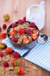 Bran Flakes With Fresh Raspberries And Strawberries And Pitcher Stock Photo