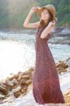 Portrait Of Beautiful Woman Wearing Straw Hat And Long Dress Sta Stock Photo