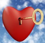 Heart With Key On Sky Background Stock Photo