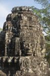 Ancient Stone Faces Of King Jayavarman Vii At The Bayon Temple, Stock Photo