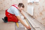 Man Laying Laminate Flooring Stock Photo