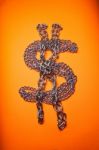 Dollar Chains On Orange Background Stock Photo