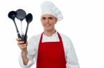 Chef Showing Kitchen Essentials Stock Photo