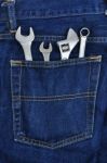 Several Tools On A Denim Workers Pocket Stock Photo