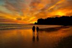 Sunset Couple On The Beach Stock Photo