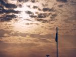 Flag And Orange Sky Stock Photo