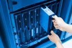 Man Fix Server Network In Data Center Room Stock Photo