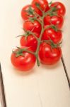 Fresh Cherry Tomatoes On A Cluster Stock Photo