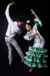 Young Flamenco Dancers In Beautiful Dress On Black Background Stock Photo