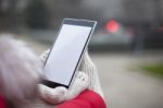 Mobile Phone In Hands With Glowes, Cold Weather Stock Photo