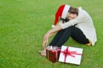 Santa Claus Hat With Red Christmas Gift Box Stock Photo