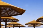 Wooden Beach Umbrellas Stock Photo