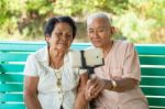 Happy Senior Couple Posing For A Selfie Stock Photo