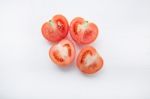 Fresh Tomatoes Slices On White Wooden Background Stock Photo