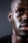 Athletic Man Running In Black Background Stock Photo