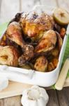 Roasted Chicken With Apples And Potatoes Stock Photo