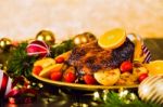 Christmas Baked Duck Served With Potatoes, Orange And Tomatoes Stock Photo