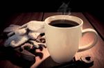 Coffee Cup And Tools On A Wooden Table. Dark Background Stock Photo