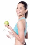 Lady Looking At Camera With Green Apple Stock Photo