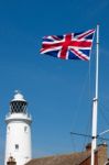 Union Jack Flag Flying Near The Lighthouse In Southwold Stock Photo