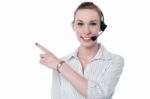 Female Call Center Executive Wearing Headset Stock Photo