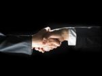 Handshaking Business People Stock Photo