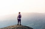 Young Man  Asia Tourist  At Mountain Is Watching Over The Misty Stock Photo