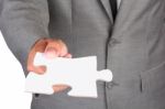 Businessman Holding Blank Jigsaw Stock Photo