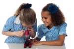 Little Girls Looking Into Microscope Stock Photo