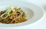 Fried Noodle With Abalone Sauce And Bbq Duck On White Dish Stock Photo