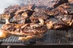 Traditional Meat Grilled On The Grill In The Argentine Countryside Stock Photo