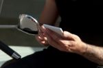 Smartphone In Hands And Moped Stock Photo