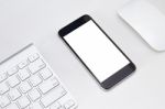 Phone White Screen On White Table Workspace Stock Photo