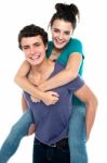 Man Giving Piggyback Ride Stock Photo