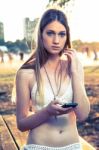 Girl With Smart Phone Near Beach Stock Photo